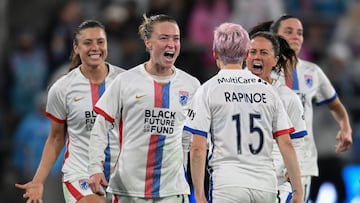 OL Reign's US midfielder #15 Megan Rapinoe celebrates with teammates OL Reign's US midfielder #02 Emily Sonnett and OL Reign's US defender #03 Lauren Barnes during the National Women's Soccer League semifinal match between the San Diego Wave and OL Reign at Snapdragon Stadium in San Diego, California, on November 5, 2023. (Photo by Robyn Beck / AFP)