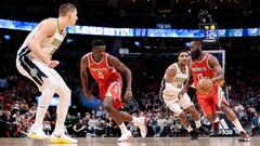 Feb 25, 2018; Denver, CO, USA; Denver Nuggets center Nikola Jokic (15) defends against Houston Rockets center Clint Capela (15) as guard Gary Harris (14) guards guard James Harden (13) in the fourth quarter at the Pepsi Center. Mandatory Credit: Isaiah J. Downing-USA TODAY Sports