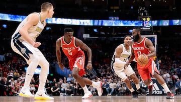 Feb 25, 2018; Denver, CO, USA; Denver Nuggets center Nikola Jokic (15) defends against Houston Rockets center Clint Capela (15) as guard Gary Harris (14) guards guard James Harden (13) in the fourth quarter at the Pepsi Center. Mandatory Credit: Isaiah J. Downing-USA TODAY Sports