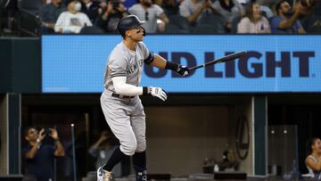 ARLINGTON, TX - OCTOBER 4: Aaron Judge #99 of the New York Yankees watches his 62nd home run of the season against the Texas Rangers during the first inning in game two of a double header at Globe Life Field on October 4, 2022 in Arlington, Texas. Judge has now set the American League record for home runs in a single season.   Ron Jenkins/Getty Images/AFP