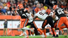 CLEVELAND, OHIO - OCTOBER 31: Jacoby Brissett #7 of the Cleveland Browns looks to throw the ball while being grabbed by BJ Hill #92 of the Cincinnati Bengals during the first half of the game at FirstEnergy Stadium on October 31, 2022 in Cleveland, Ohio.   Nick Cammett/Getty Images/AFP