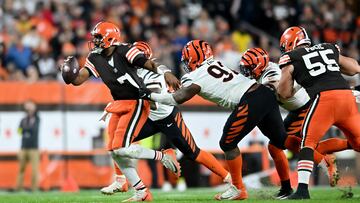 CLEVELAND, OHIO - OCTOBER 31: Jacoby Brissett #7 of the Cleveland Browns looks to throw the ball while being grabbed by BJ Hill #92 of the Cincinnati Bengals during the first half of the game at FirstEnergy Stadium on October 31, 2022 in Cleveland, Ohio. Nick Cammett/Getty Images/AFP