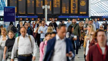 Commuters walk along the concourse after arriving at London Waterloo railway station in London, UK, on Monday, June 20, 2022. Britain's biggest train strike in 30 years is set to upend travel Tuesday as the world's oldest railroad struggles to redefine its role in a commuting landscape transformed by the coronavirus crisis. Photographer: Luke MacGregor/Bloomberg via Getty Images