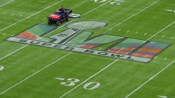 A worker prepares the field ahead of Super Bowl LVII between the Philadelphia Eagles and the Kansas City Chiefs at State Farm Stadium in Glendale, Arizona, on February 11, 2023. (Photo by ANGELA WEISS / AFP)