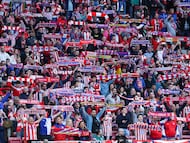 Atletico Madrid supporters cheer during the UEFA Champions League knockout round play-off second leg football match between Club Atletico de Madrid and Club Brugge KV at Metropolitano Stadium in Madrid on February 24, 2026. (Photo by Thomas COEX / AFP)