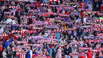 Atletico Madrid supporters cheer during the UEFA Champions League knockout round play-off second leg football match between Club Atletico de Madrid and Club Brugge KV at Metropolitano Stadium in Madrid on February 24, 2026. (Photo by Thomas COEX / AFP)
