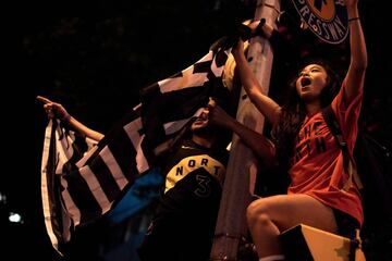 Toronto Raptors fans celebrate their win in the NBA championships in downtown Toronto, Ontario on early June 14, 2019. 