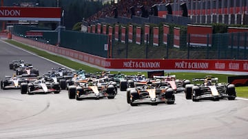 McLaren's Australian driver Oscar Piastri takes the first corner ahead of Red Bull Racing's Dutch driver Max Verstappen after the start of the Sprint Race of the Formula One Belgian Grand Prix at the Spa-Francorchamps circuit in Spa, on July 26, 2025. (Photo by SIMON WOHLFAHRT / AFP)