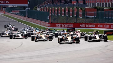 McLaren's Australian driver Oscar Piastri takes the first corner ahead of Red Bull Racing's Dutch driver Max Verstappen after the start of the Sprint Race of the Formula One Belgian Grand Prix at the Spa-Francorchamps circuit in Spa, on July 26, 2025. (Photo by SIMON WOHLFAHRT / AFP)