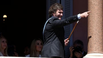 FILE PHOTO: Argentina's President Javier Milei gestures to supporters from the Casa Rosada balcony, as his sister Karina Milei and his partner Fatima Florez look on, after his swearing-in ceremony, in Buenos Aires, Argentina December 10, 2023. REUTERS/Agustin Marcarian/File Photo