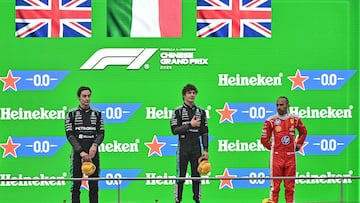 Winner Mercedes' Italian driver Kimi Antonelli (C), second-placed Mercedes' British driver George Russell (L) and third-placed Ferrari's British driver Lewis Hamilton (R) celebrate on the podium after the Formula One Chinese Grand Prix at the Shanghai International Circuit in Shanghai on March 15, 2026. (Photo by HECTOR RETAMAL / AFP)