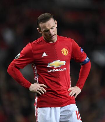 Rooney cuts a dejected figure at Old Trafford, falling out of favour under new coach Jose Mourinho