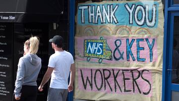 LEIGH ON SEA, ENGLAND - APRIL 08: People walk past a local shop that has decorated its window thanking NHS and key workers on April 8, 2020 in Leigh on Sea, England. There have been around 50,000 reported cases of the COVID-19 coronavirus in the United Ki