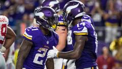 Oct 3, 2016; Minneapolis, MN, USA; Minnesota Vikings running back Jerick McKinnon (21) celebrates his touchdown with wide receiver Stefon Diggs (14) during the fourth quarter against the New York Giants at U.S. Bank Stadium. The Vikings defeated the Giants 24-10. Mandatory Credit: Brace Hemmelgarn-USA TODAY Sports