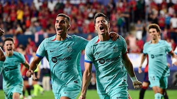 Barcelona's Spanish forward #07 Ferran Torres (L) celebrates Barcelona's Polish forward #09 Robert Lewandowski's goal scored from the penalty spot during the Spanish Liga football match between CA Osasuna and FC Barcelona at El Sadar stadium in Pamplona on September 3, 2023. (Photo by ANDER GILLENEA / AFP)