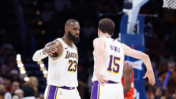 Los Angeles Lakers forward LeBron James (23) and guard Austin Reaves (15) celebrate after a play against the Oklahoma City Thunder during the second half at Paycom Center.