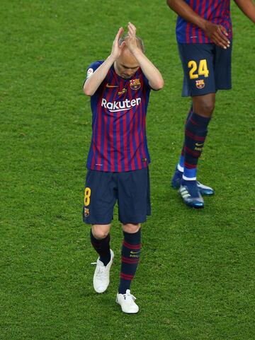 Andres Iniesta walks off the pitch. Iniesta, who joined Barcelona's academy 22 years ago, played his final game for the club.