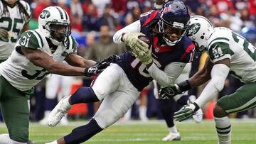 Nov 22, 2015; Houston, TX, USA; Houston Texans wide receiver DeAndre Hopkins (10) is tackled by New York Jets cornerback Darrelle Revis (24) during the first quarter of a game at NRG Stadium. Mandatory Credit: Ray Carlin-USA TODAY Sports