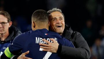 Soccer Football - Champions League - Round of 16 - Second Leg - Real Sociedad v Paris St Germain - Reale Arena, San Sebastian, Spain - March 5, 2024 Paris St Germain's Kylian Mbappe celebrates with coach Luis Enrique after the match REUTERS/Vincent West