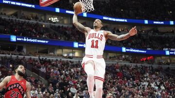 Mar 21, 2022; Chicago, Illinois, USA; Chicago Bulls forward DeMar DeRozan (11) goes up for a dunk against the Toronto Raptors during the first quarter at United Center. Mandatory Credit: David Banks-USA TODAY Sports