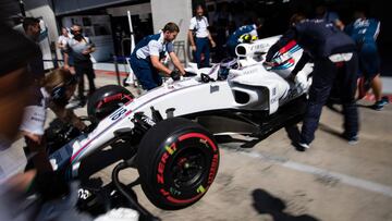 Williams' Canadian driver Lance Stroll is pushed back into the garage during the first practice session of the Formula One Austria Grand Prix at the Red Bull Ring in Spielberg, on July 7, 2017. / AFP PHOTO / ANDREJ ISAKOVIC