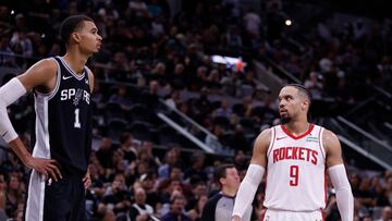 Victor Wembanyama #1 of the San Antonio Spurs is checked out by Dillon Brooks #9 of the Houston Rockets in the second half at Frost Bank Center on October 27, 2023 in San Antonio, Texas.