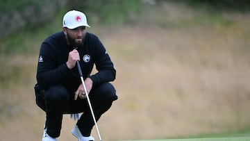 Spain's Jon Rahm lines up a putt on the 11th green on the opening day of the 152nd British Open Golf Championship at Royal Troon on the south west coast of Scotland on July 18, 2024. (Photo by ANDY BUCHANAN / AFP) / RESTRICTED TO EDITORIAL USE