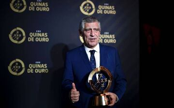 Portugal's coach Fernando Santos poses with the trophy of Best Coach 2016 at "Quinas de Ouro" ceremony at the Estoril Congress Center in Estoril, outskirts of Lisbon, on March 20, 2017.