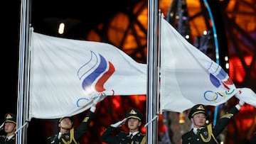 BEIJING, CHINA - FEBRUARY 18: The flag of ROC is raised after Gold medallist Anna Shcherbakova of Team ROC and Silver Medallist Alexandra Trusova of Team ROC during the Women Single Skating Medal Ceremony on Day 14 of the Beijing 2022 Winter Olympic Games