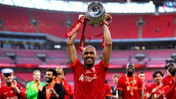 Liverpool's Fabinho celebrates with the trophy after winning the Emirates FA Cup final at Wembley Stadium, London. Picture date: Saturday May 14, 2022. (Photo by Adam Davy/PA Images via Getty Images)