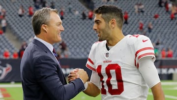 John Lynch next to Jimmy Garoppolo