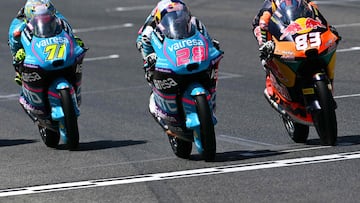 (From L) RW-Idrofoglia Raging GP team's Japanese Moto2 rider Ayumu Sasaki, CFMOTO Gaviota Aspar Team's Spanish Moto3 rider Maximo Quiles and Red Bull KTM Tech3 team's Spanish Moto3 rider Alvaro Carpe steer their motorbikes during the Moto3 race of the Italian Moto GP Grand Prix at Mugello circuit, in Mugello, near Florence, on June 22, 2025. (Photo by Tiziana FABI / AFP)