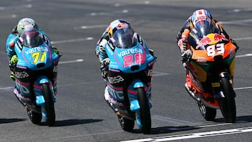 (From L) RW-Idrofoglia Raging GP team's Japanese Moto2 rider Ayumu Sasaki, CFMOTO Gaviota Aspar Team's Spanish Moto3 rider Maximo Quiles and Red Bull KTM Tech3 team's Spanish Moto3 rider Alvaro Carpe steer their motorbikes during the Moto3 race of the Italian Moto GP Grand Prix at Mugello circuit, in Mugello, near Florence, on June 22, 2025. (Photo by Tiziana FABI / AFP)
