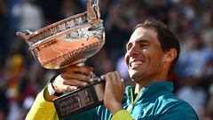 Spain's Rafael Nadal poses with The Musketeers' Cup as he celebrates after victory over Norway's Casper Ruud during their men's singles final match on day fifteen of the Roland-Garros Open tennis tournament at the Court Philippe-Chatrier in Paris on June 