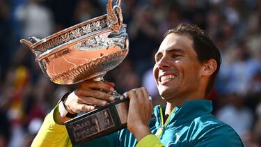 Spain's Rafael Nadal poses with The Musketeers' Cup as he celebrates after victory over Norway's Casper Ruud during their men's singles final match on day fifteen of the Roland-Garros Open tennis tournament at the Court Philippe-Chatrier in Paris on June