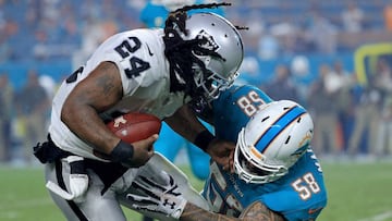 MIAMI GARDENS, FL - NOVEMBER 05: Marshawn Lynch #24 of the Oakland Raiders is tackled by Rey Maualuga #58 of the Miami Dolphins during a game at Hard Rock Stadium on November 5, 2017 in Miami Gardens, Florida.   Mike Ehrmann/Getty Images/AFP
 == FOR NEWSPAPERS, INTERNET, TELCOS &amp; TELEVISION USE ONLY ==