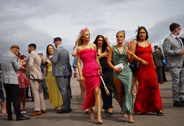 Racegoers attend the second day of the Grand National Festival horse race meeting at Aintree Racecourse in Liverpool, north-west England, on April 12, 2024. (Photo by Oli SCARFF / AFP)