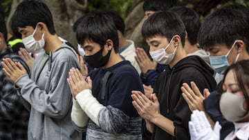 ITOMAN, JAPAN - NOVEMBER 29: People pray in front of the Himeyuri-no-to on November 29, 2020 in Itoman, Japan. September 2 marks the 75th anniversary of the formal surrender of Japan and the end of World War II. (Photo by Yuichi Yamazaki/Getty Images)