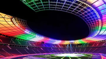 (FILES) In this file photo taken on October 5, 2021 the Olympic stadium is lit up with the colors of the new UEFA Euro 2024 football championship logo, presented at the Olympic stadium in Berlin. - UEFA announced on May 10, 2022, the UEFA EURO 2024 footba