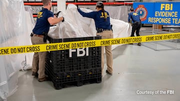 An undated U.S. Federal Bureau of Investigation handout photo taken at an undisclosed location shows FBI Special Agents assigned to the bureau’s Evidence Response Team processing material recovered from the high-altitude Chinese balloon that was shot down by a U.S. military jet off the coast of South Carolina, in this image released by the FBI on February 9, 2023.  FBI/Handout via Reuters THIS IMAGE HAS BEEN SUPPLIED BY A THIRD PARTY.