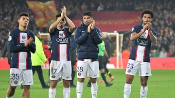 (From L) Paris Saint-Germain's French midfielder Ismael Gharbi, Paris Saint-Germain's Portuguese midfielder Vitinha, Paris Saint-Germain's Spanish midfielder Carlos Soler and Paris Saint-Germain's French midfielder Warren Zaire-Emery applauds at the crowd after the French L1 football match between RC Lens and Paris Saint Germain (PSG) at the Bollaert-Delelis Stadium in Lens, northern France on January 1, 2023. - Paris Saint-Germain lost for the first time in any competition since March 20 last year when they were defeated 3-1 at Lens. (Photo by FRANCOIS LO PRESTI / AFP) (Photo by FRANCOIS LO PRESTI/AFP via Getty Images)