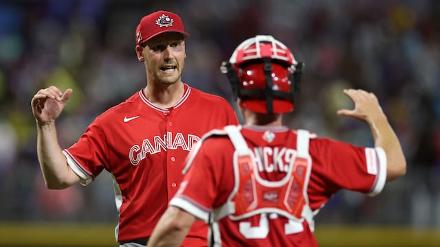 SAN JUAN, PUERTO RICO - MARCH 10: Brock Dykxhoorn #44 of Team Canada celebrates with Liam Hicks #34 after recording the last out of the 3-2 victory against Team Puerto Rico at Hiram Bithorn Stadium on March 10, 2026 in San Juan, Puerto Rico. Al Bello/Getty Images/AFP (Photo by AL BELLO / GETTY IMAGES NORTH AMERICA / Getty Images via AFP)