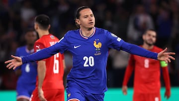 France's forward #20 Florian Thauvin (C) celebrates after scoring France's third goal during the FIFA World Cup 2026 Group D European qualification football match between France and Azerbaidjan at the Parc des Princes Stadium in Paris, on October 10, 2025. (Photo by Anne-Christine POUJOULAT / AFP)