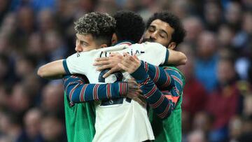 BIRMINGHAM, ENGLAND - MAY 10: Luis Diaz of Liverpool hugs Roberto Firmino and Mohamed Salah after providing the assist for their 2nd goal during the Premier League match between Aston Villa and Liverpool at Villa Park on May 10, 2022 in Birmingham, United Kingdom. (Photo by Simon Stacpoole/Offside/Offside via Getty Images)