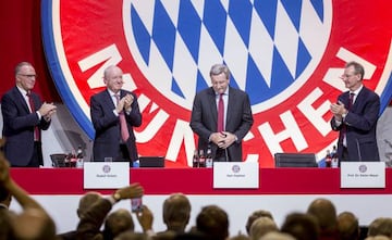 President of FC Bayern Muenchen Karl Hopfner (2nd R) reacts beside Chairman of the board Karl-Heinz Rummenigge (L), First Vice President Rudolf Schels and Vice President Dieter Mayer (R) during the FC Bayern Muenchen Annual General Assembly at Audi-Dome o