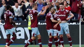 West Ham United's Algerian midfielder Said Benrahma (R) celebrates scoring his team's first goal with teammates during the English Premier League football match between West Ham United and Manchester United at the London Stadium, in London on May 7, 2023. (Photo by Ian Kington / AFP) / RESTRICTED TO EDITORIAL USE. No use with unauthorized audio, video, data, fixture lists, club/league logos or 'live' services. Online in-match use limited to 120 images. An additional 40 images may be used in extra time. No video emulation. Social media in-match use limited to 120 images. An additional 40 images may be used in extra time. No use in betting publications, games or single club/league/player publications. /