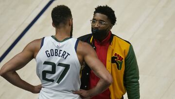 Utah Jazz's Donovan Mitchell, right, speaks with teammate Rudy Gobert (27) after he fouls out during the second half of Game 1 of their NBA basketball first-round playoff series against the Memphis Grizzlies Sunday, May 23, 2021, in Salt Lake City. (AP Photo/Rick Bowmer)