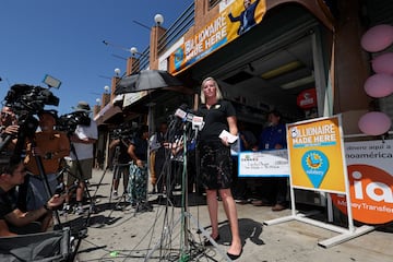 Lottery Communications Director Carolyn Becker speaks to the media in front of Las Palmitas Mini Market 
