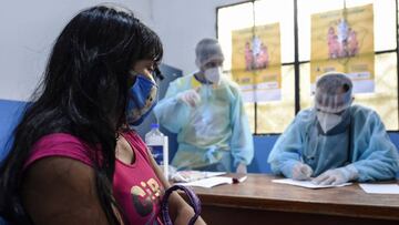 Brazilian indigenous Anita, of the Marubo ethnic group, is notified that she contracted the new coronavirus by a member of the medical team of the Brazilian Armed Forces at health post in Atalaia do Norte, Amazonas state, northern Brazil, on the border with Peru, on June 20, 2020. - As the new coronavirus has ravaged Brazil, more than 7,000 indigenous people have contracted the virus, and more than 300 have died, according to the Brazilian Indigenous Peoples&#039; Association (APIB), forcing many indigenous groups to take matters into their own hands. Some have locked the world out, banning outsiders and putting up a makeshift roadblock at the entrance to their territory, while others have fled into the jungle. (Photo by EVARISTO SA / AFP)