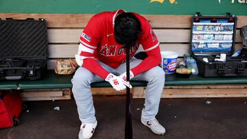 OAKLAND, CALIFORNIA - SEPTEMBER 01: Shohei Ohtani #17 of the Los Angeles Angels rests his head on his bat in the dugout before their game against the Oakland Athletics at RingCentral Coliseum on September 01, 2023 in Oakland, California. Ezra Shaw/Getty Images/AFP (Photo by EZRA SHAW / GETTY IMAGES NORTH AMERICA / Getty Images via AFP)